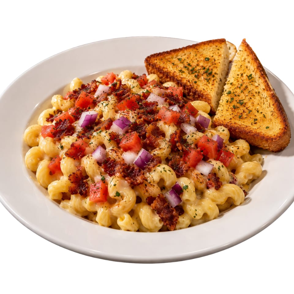 Creamy macaroni topped with bacon, diced tomatoes, red onion, and herbs, served with two slices of garlic toast.